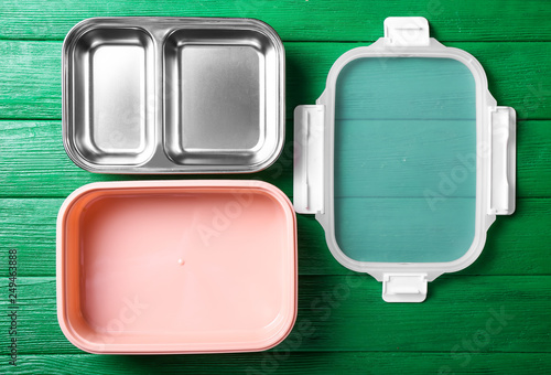 Empty school lunch box on color wooden background