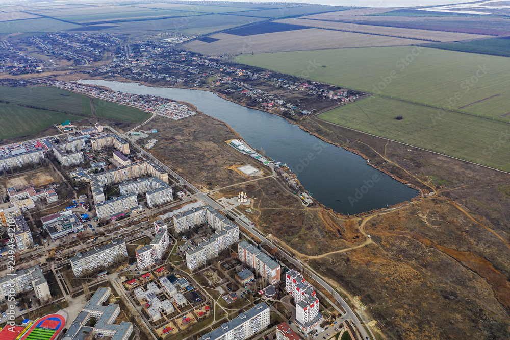 Aerial top view photo from a flying drone of global city of Yuzhny, Odessa,, with development buildings, energy power infrastructure. Financial and business centers in small provincial Ukrainian town