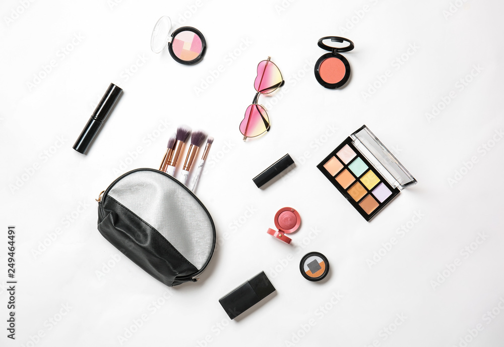 Stylish female sunglasses with makeup cosmetics on white background Stylish female sunglasses with makeup cosmetics on white background