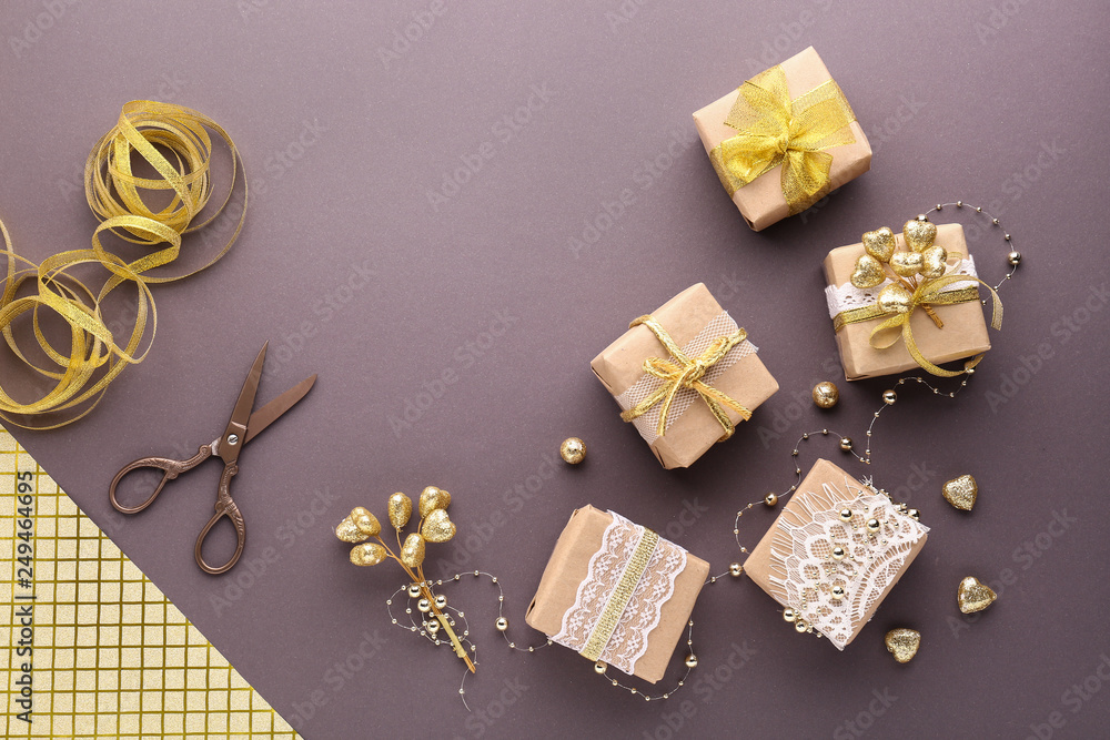 Composition with beautiful handmade gifts on color background Composition with beautiful handmade gifts on color background