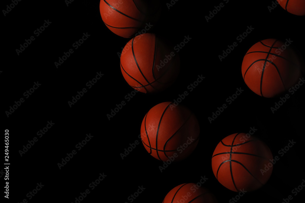 Fototapeta Stroboscopic photo of moving ball on dark background