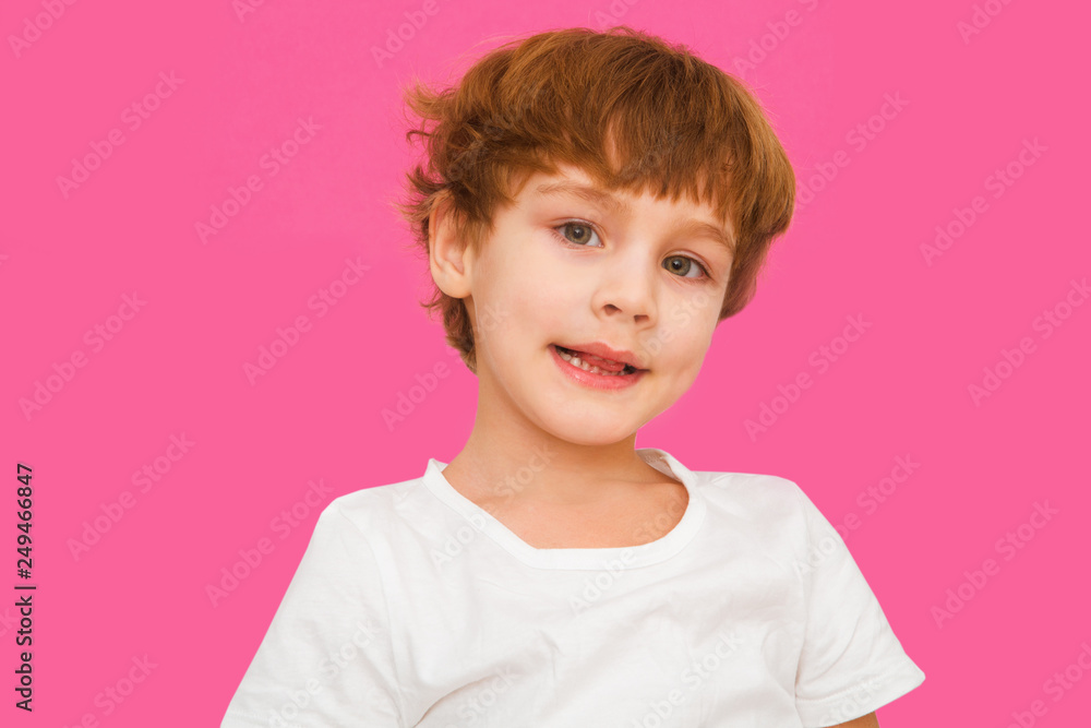 portrait of the cheerful child on a pink background portrait of the cheerful child on a pink background