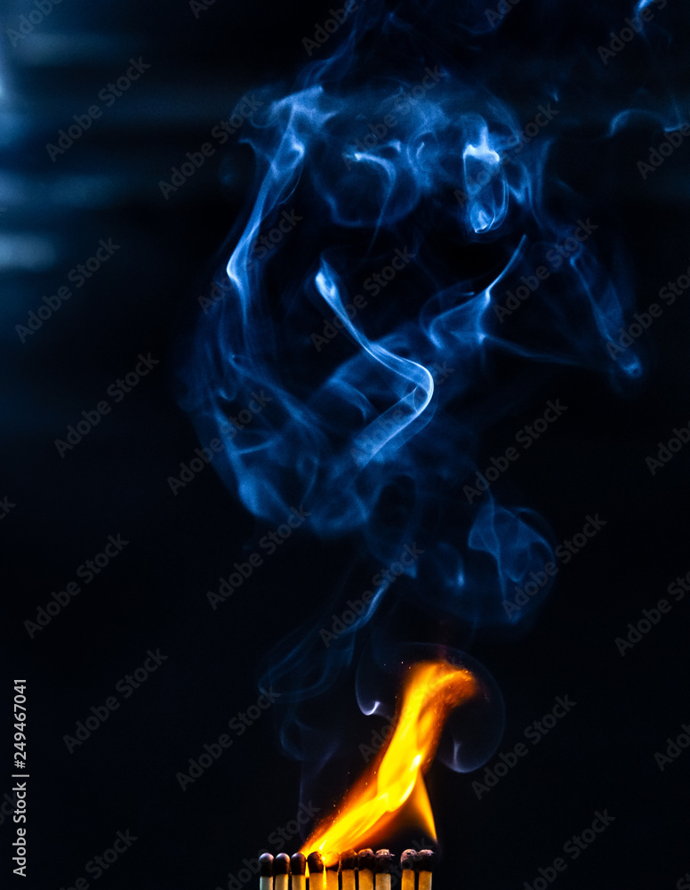 Fototapeta premium Match, smoke and flame