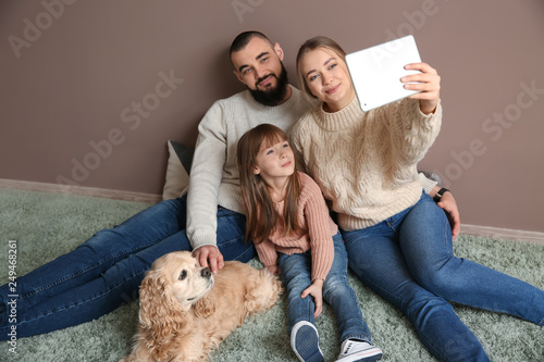 Happy family with cute dog ...