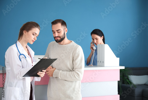 Doctor consulting patient i...
