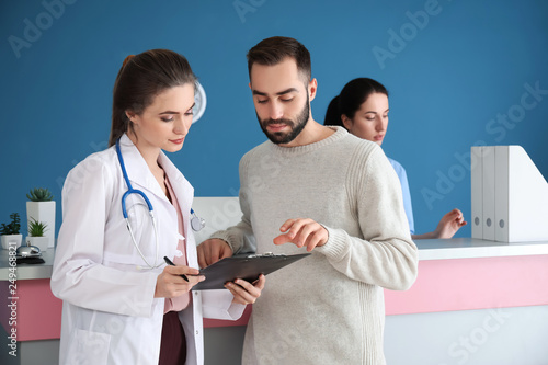 Doctor consulting patient i...