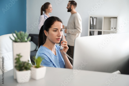 Female receptionist talking...