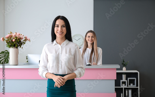 Young female receptionist in hotel photo