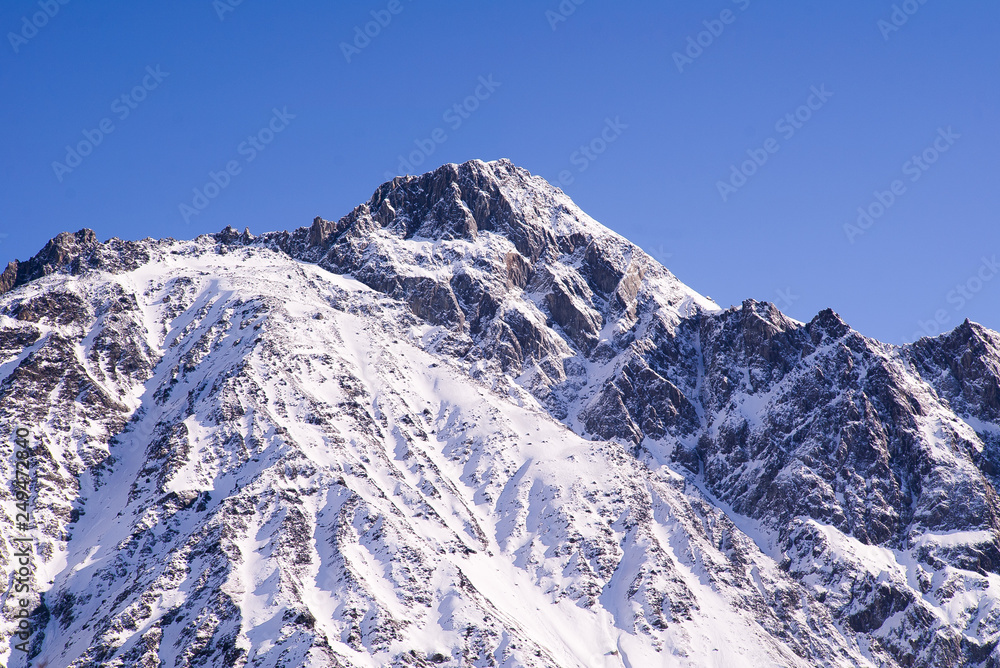 Winter mountains with Sunny day. Kazbegi