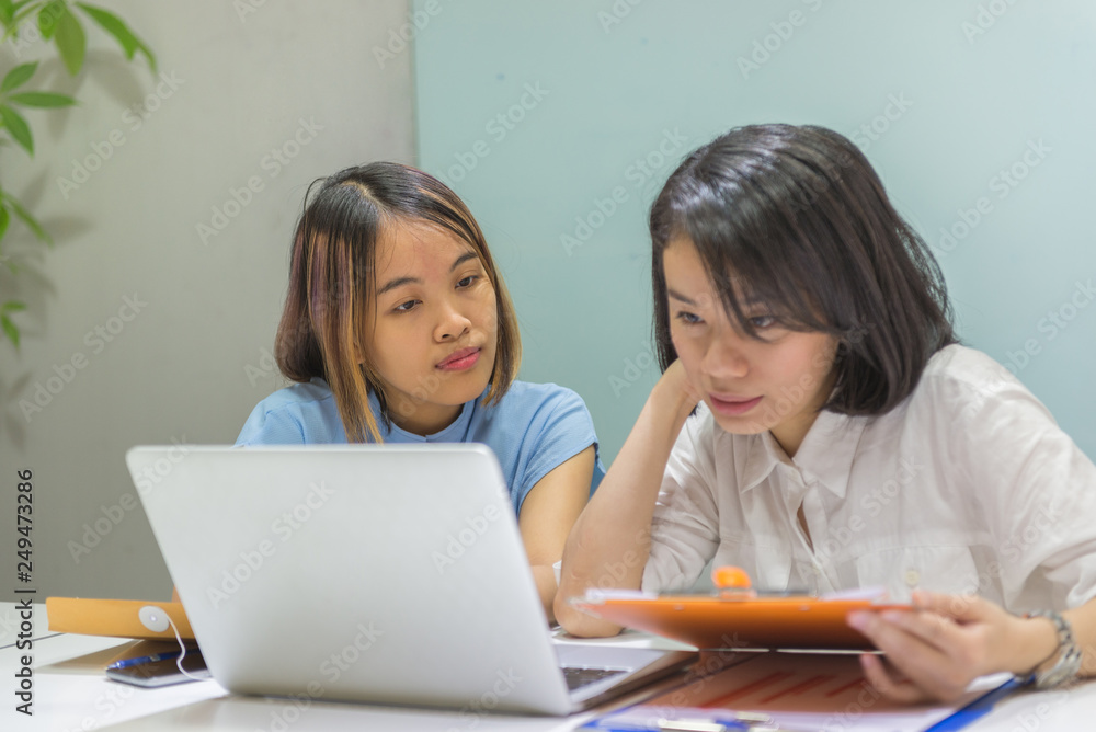 Office woman discuss about work on laptop at workplace Office woman discuss about work on laptop at workplace