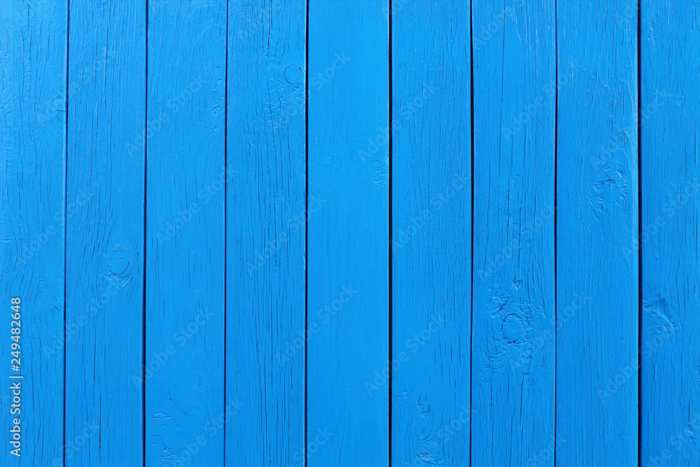 Naklejka premium Old wooden painted boards of blue color. Vertical view. Close-up. Background. Texture.