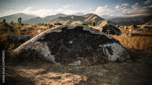 Rock painting aka petroglypgs at the field in Cholpon-Ata  Issyk-kul  Kyrgyzstan