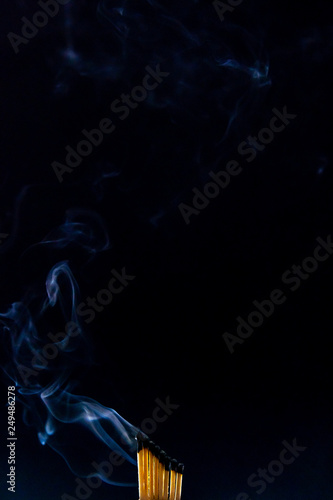 Match, smoke and flame photo