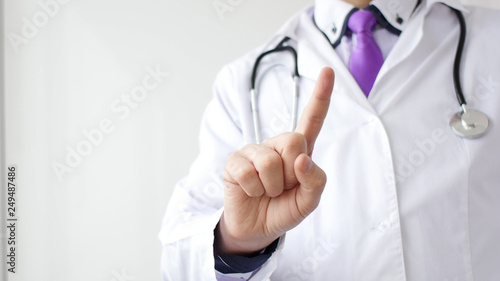 Medical doctor making negative sign for medicine by his finger.