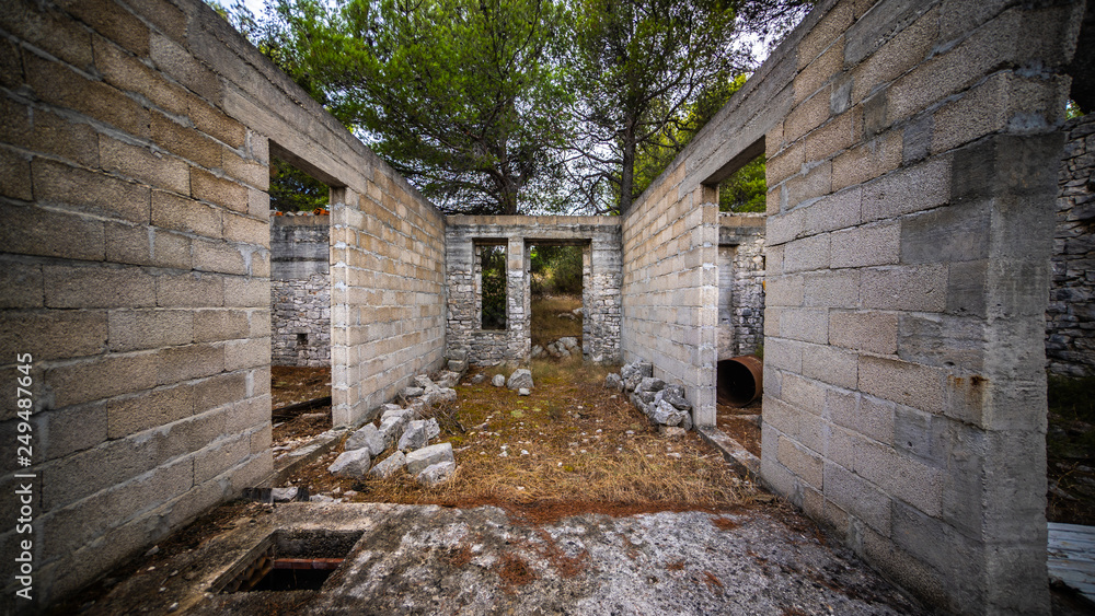old house with no ruff on an island in Croatia, great trees in the background old house with no ruff on an island in Croatia, great trees in the background