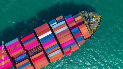 Container ship arriving in port, container ship going to deep sea port, logistic business import export shipping and transportation, Aerial view.