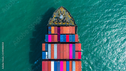 Container ship arriving in port, container ship going to deep sea port, logistic business import export shipping and transportation, Aerial view. © Kalyakan