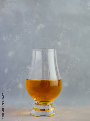 Irish Whiskey Glass Textured Paper Background Portrait Close Up