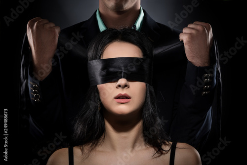 Couple Love Kiss, Sexy Blindfolded Woman and elegant Man in Suit photo