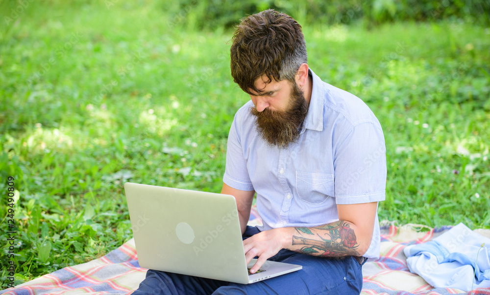 Man bearded with laptop sit meadow nature background. Blogger becoming inspired by nature. Writer looking for inspiration nature environment. Inspiration for blogging. Looking for inspiration Man bearded with laptop sit meadow nature background. Blogger becoming inspired by nature. Writer looking for inspiration nature environment. Inspiration for blogging. Looking for inspiration