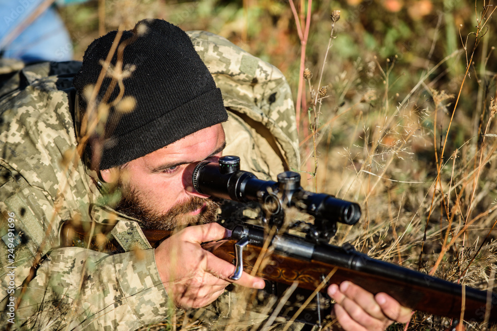 Hunting skills and weapon equipment. How turn hunting into hobby. Bearded man hunter. Army forces. Camouflage. Military uniform fashion. Man hunter with rifle gun. Boot camp. Army soldiers