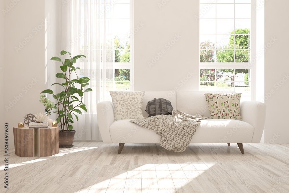 Fototapeta premium White stylish minimalist room with sofa and summer landscape in window. Scandinavian interior design. 3D illustration