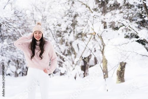 Portrait Young Beautiful asian woman smile happy travel and enjoy with snow winter season