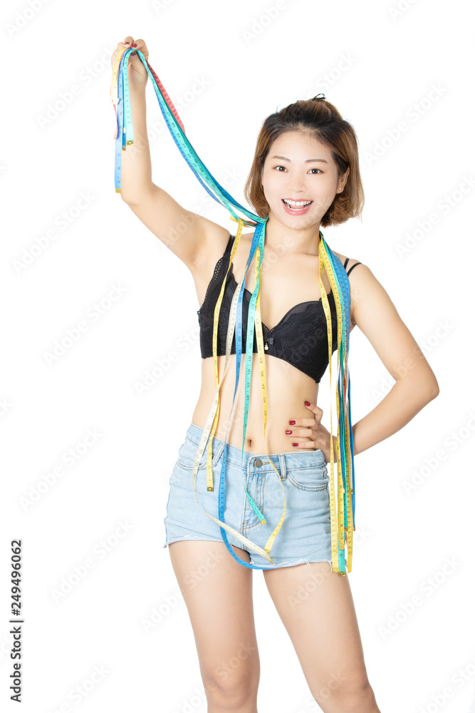 Chinese woman posing in bra and jean shorts on white background Chinese woman posing in bra and jean shorts on white background