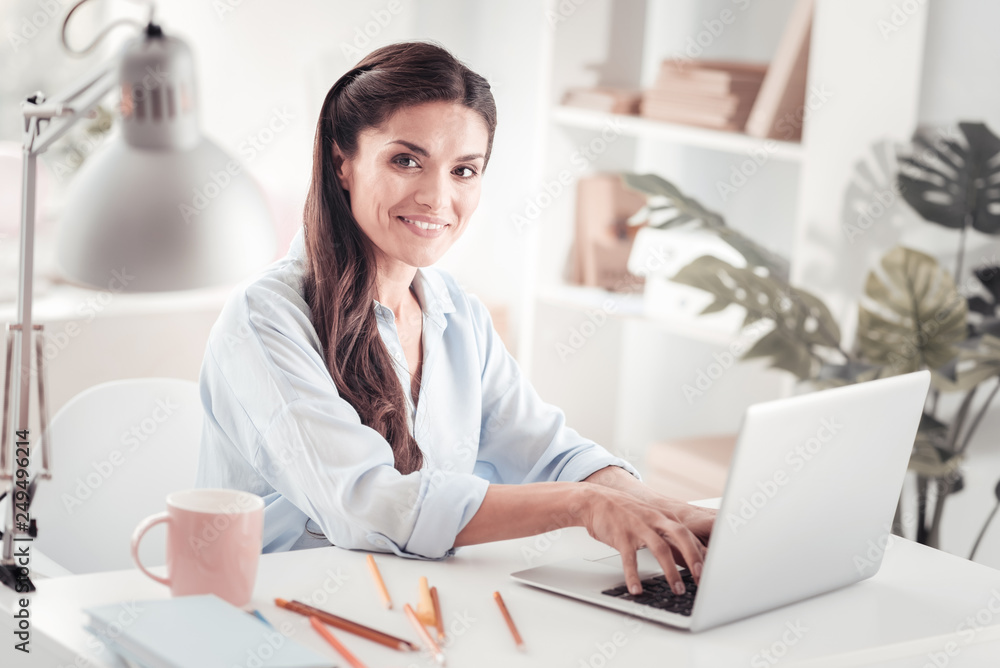 Motivated young mother creating business plan for new start up Motivated young mother creating business plan for new start up