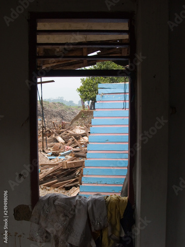 destroyed village after landslide on a dump near  cimahio, bandung, java, indonesia photo