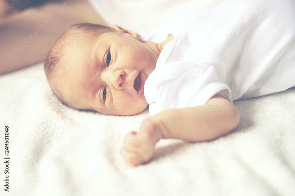 concept of maternal - newborn baby with mother laying on the bed concept of maternal - newborn baby with mother laying on the bed
