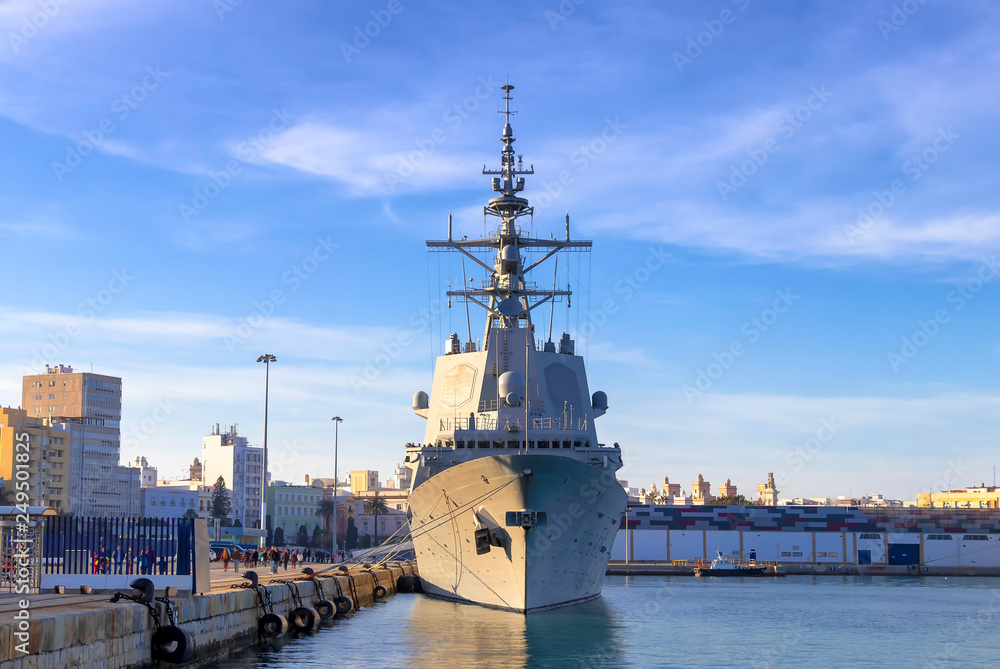 Battleship moored in the Cadiz bay port at sunset Battleship moored in the Cadiz bay port at sunset