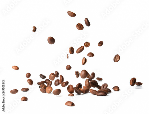 Falling roasted coffee beans. Chaotic motion. White isolated background.