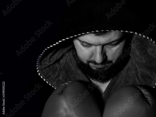 brutal bearded boxer in hood. ready to fight. Boxing, workout, muscle, strength, power - sport concept. Black and white.