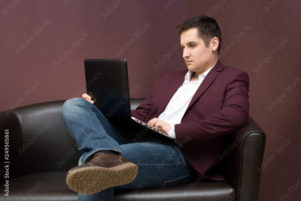 Young successful businessman with a laptop in hand. Young successful businessman with a laptop in hand.