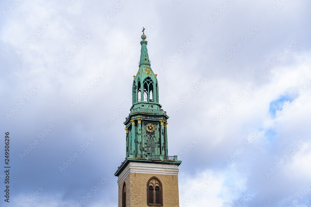 St. Mary Church Berlin isolated on natural blue sky background, The St. Mary Church located on the Alexanderplatz in Berlin, Germany, 