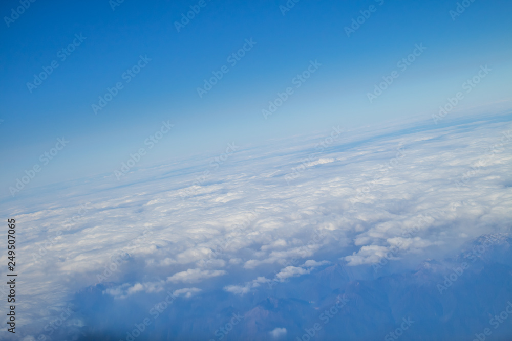 Fototapeta premium White clouds looking from the plane