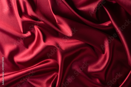 texture, red silk fabric panoramic photo. Silk Duke mood satin - beautiful and regal.