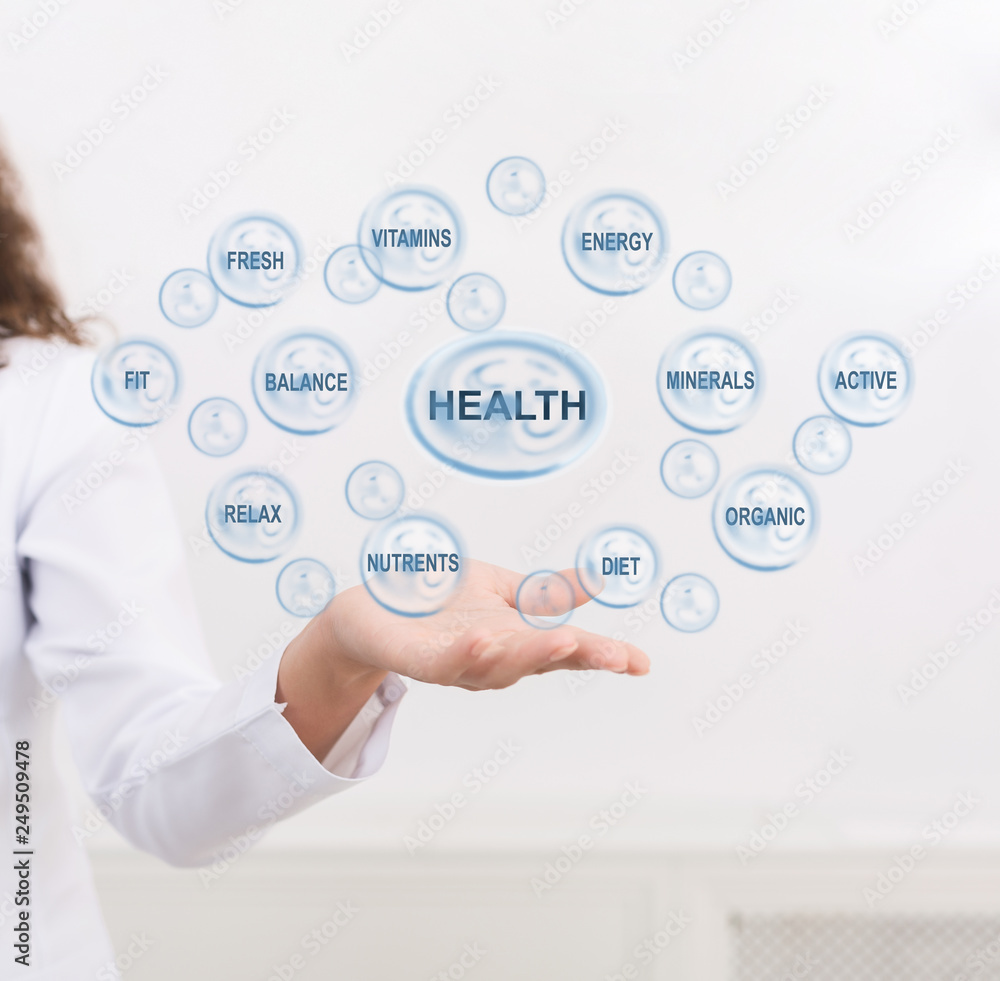 Doctor points at health caring icon with other medical signs Doctor points at health caring icon with other medical signs