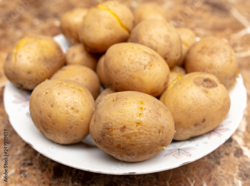 Boiled potatoes in a plate on the table