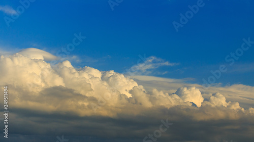 Clouds after rain before sunset as a background