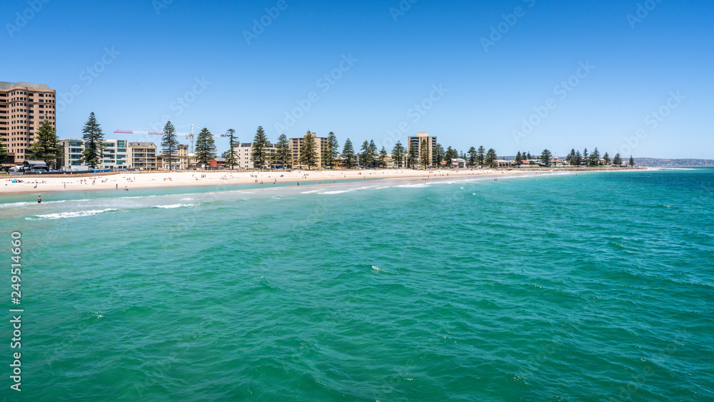 Distant view of Glenelg beach in Adelaide suburb on hot sunny summer day in SA Australia