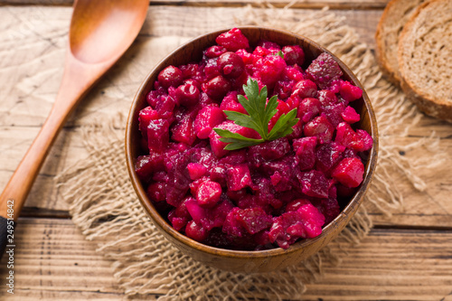 Slika na platnu Fresh homemade beet salad vinaigrette in a wooden bowl