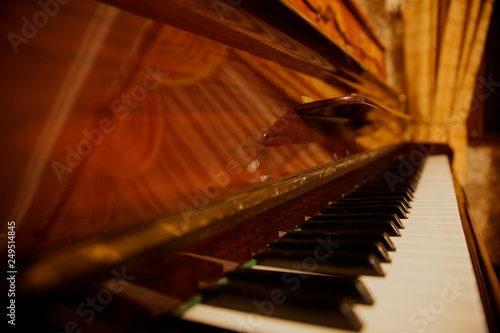 Old beautiful wooden piano.
