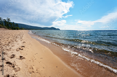 Lake Baikal in summer. Beautiful sandy beach near the village of Khakusy in the northern part of the lake. Coastal landscape photo