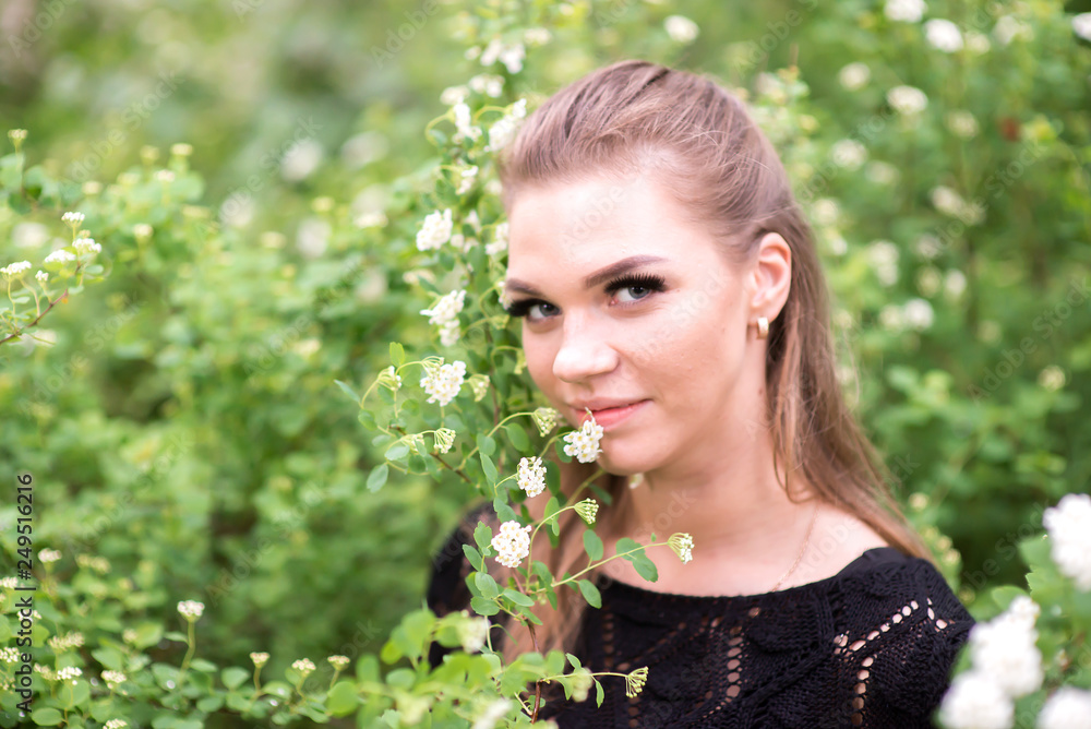 Beautiful girl on the background of spring bush Beautiful girl on the background of spring bush