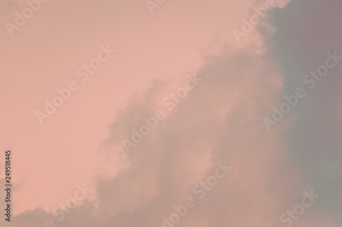 Coral colored sky background with clouds. Abstract image.