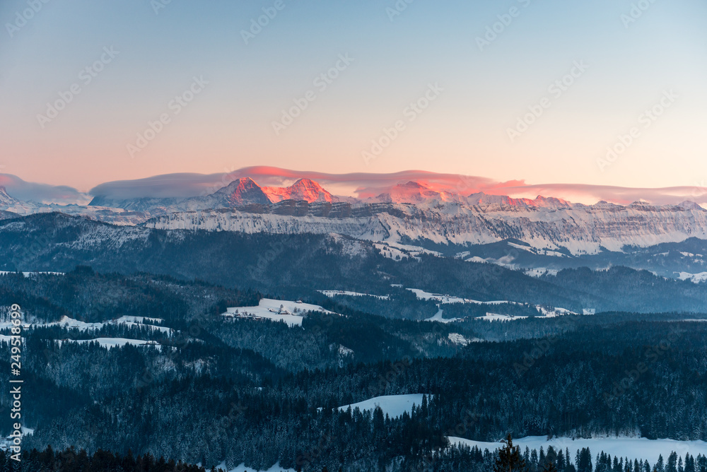 Obraz premium Alpenglow in winter on Eiger Mönch and Jungfrau in the Bernese Alps