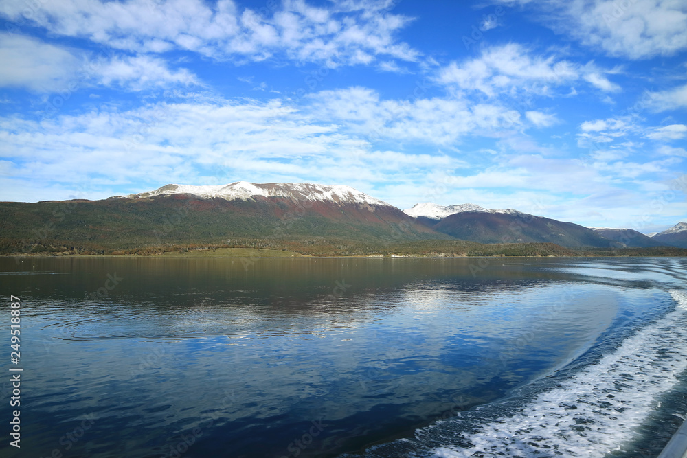 Curve line of water foam at the stern of cruise ship cruising the Beagle channel, Patagonia, Argentina Curve line of water foam at the stern of cruise ship cruising the Beagle channel, Patagonia, Argentina