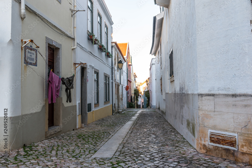 Cobblestone alley in traditional old neighbourhood in Cascais Portugal